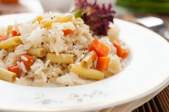 large plate of delicious rice with vegetables