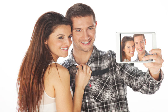 Happy couple makes self-photo on the notebook