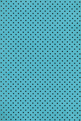 Cyan paper background with polka dot pattern