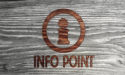 Isolated Info-point symbol n a wooden background