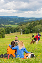 Hiking friends taking picture in scenic landscape