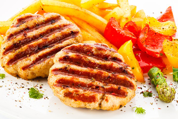 Grilled steak, French fries and vegetables