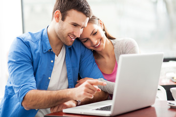 Couple looking at laptop