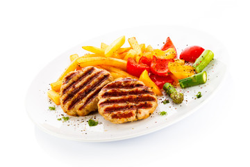 Grilled steak, French fries and vegetables