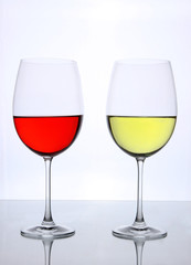Red and white wine glasses isolated on white