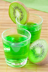 Green kiwi juice in small glass