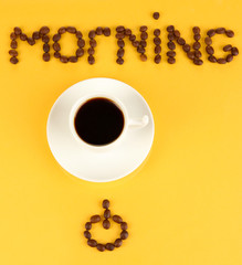 Cup of strong coffee on yellow background