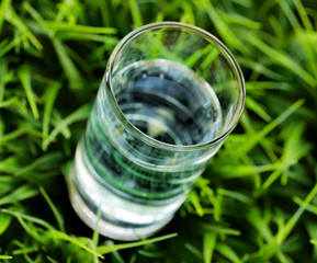 Glass of water on nature background