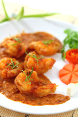 Fried prawn balls in red curry.