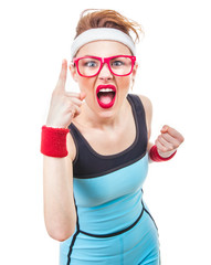 Angry funny fitness woman gesturing at warning