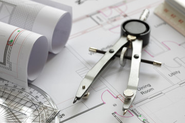 Drawing compass on house plan