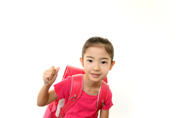 ランドセルを背負った笑顔の女の子