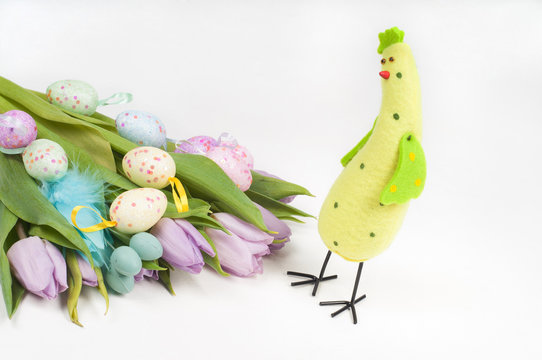Easter chicken with tulips and eggs