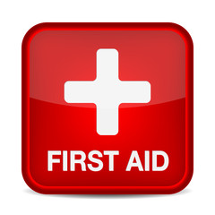 Obraz premium First aid medical button sign isolated on white.