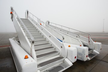 Mobile gangway for airplanes - airport in fog