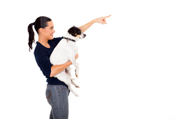 happy woman holding dog and pointing