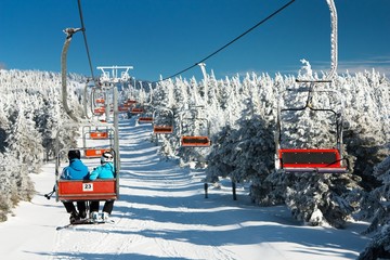 chair lift on mountain for downhill skiers