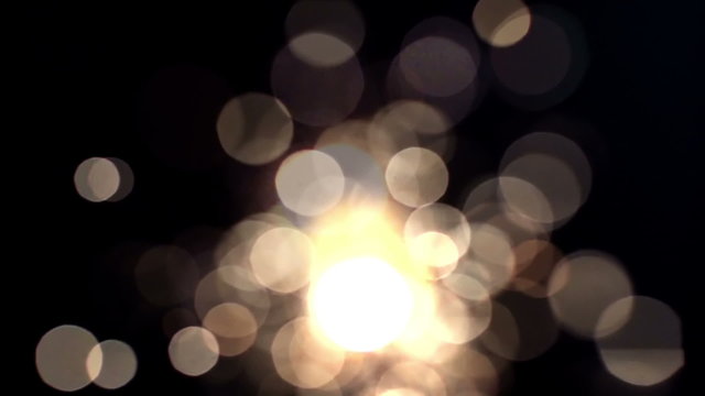 a sparkler being ignited making abstract pattern in slow motion