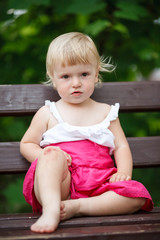 little girl on park bench