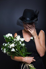 widow crying at funeral