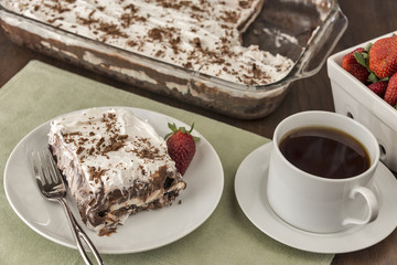 Chocolate cream dessert with strawberries and coffee