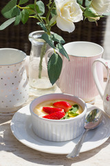 creme brulee with fresh strawberry and green mint