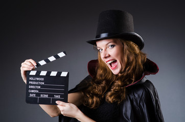 Woman with movie clapper board