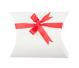 White gift box with scarlet ribbon, isolated on white