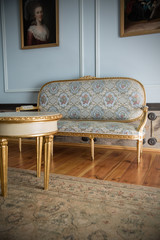 Ancient and beautiful couch in a rich chamber hall