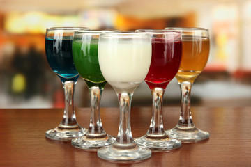 Tasty color liquors, on bright background
