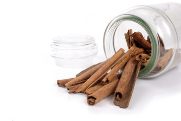 Bottle and cinnamons