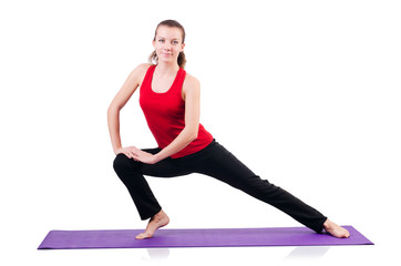 Obraz premium Young female doing exercises on white