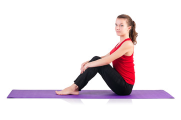 Young female doing exercises on white