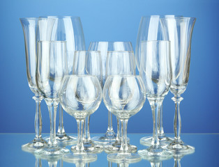 Collection of wine glasses, on blue background