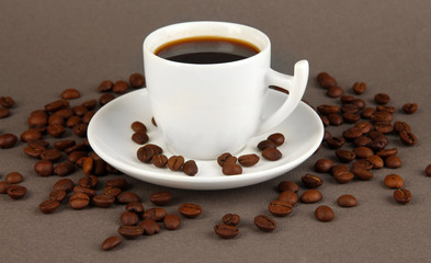 Cup of strong coffee on grey background
