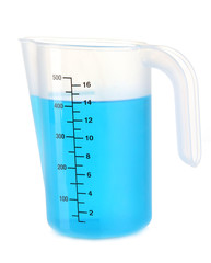 Measuring cup with blue liquid isolated on white