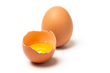 Two brown eggs isolated on white background