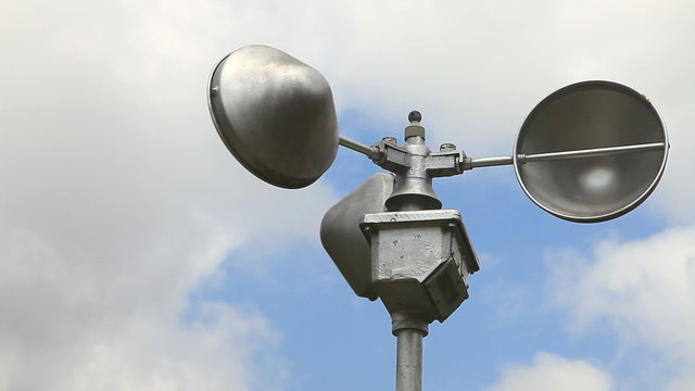 Anemometer rotating in the cloudy day