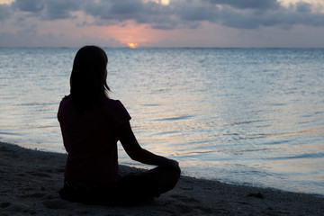 woman meditation on the beach
