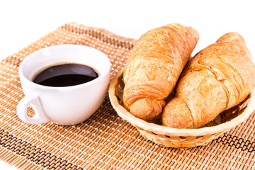 Fresh and tasty French croissants and cup of coffee served