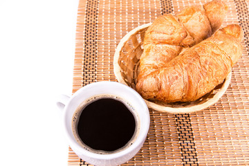 Fresh and tasty French croissants and cup of coffee served