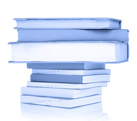 Stack of books in blue light