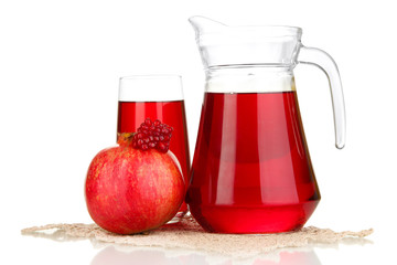 Full glass and jug of pomegranate juice and pomegranate