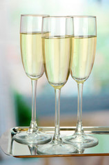 Corporate party: sparkling champagne glasses on tray