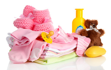 Pile of baby clothes isolated on white