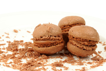 Three sponge drops from cocoa dough with cream and crumbs