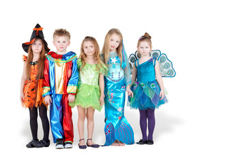 Obraz premium Children in carnival costumes stand in line with serious faces