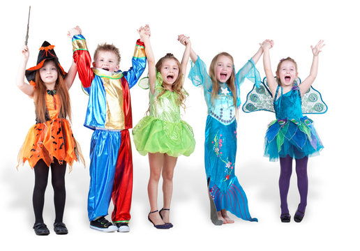 Children stand holding hands and lifting them up and shout