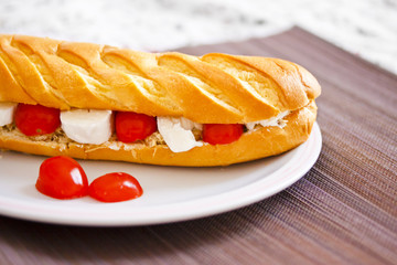 healthy baguette bread with tuna, tomatoes and mozzarella