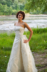 Fototapeta na wymiar Pretty girl in a wedding dress